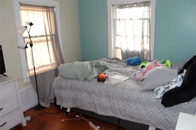 bedroom featuring dark hardwood / wood-style flooring