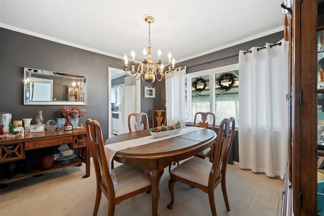 carpeted dining space with crown molding and an inviting chandelier