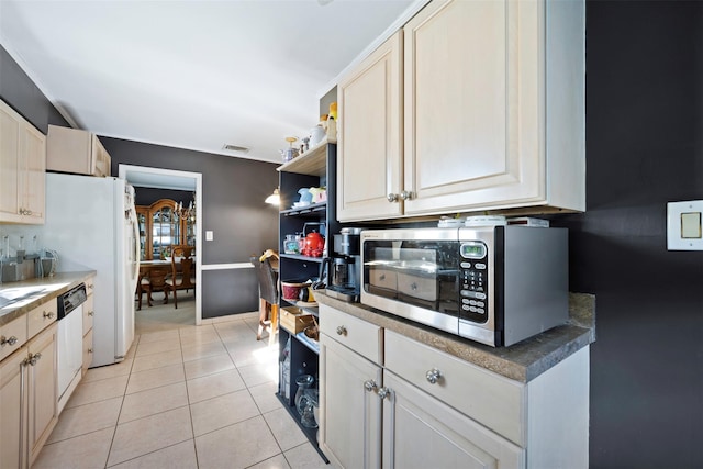 kitchen with white dishwasher and light tile patterned floors