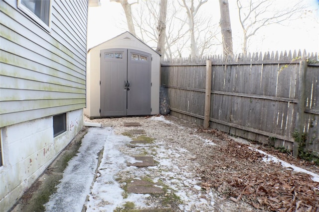 view of shed with fence