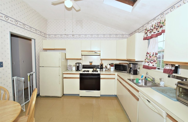 101 Bishop Rd, West Babylon, NY 11704 - kitchen with white appliances, under cabinet range hood, a sink, wallpapered walls, and light countertops