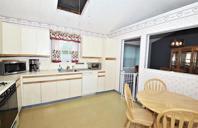 101 Bishop Rd, West Babylon, NY 11704 - kitchen with dishwasher, wallpapered walls, stainless steel microwave, gas range oven, and a sink