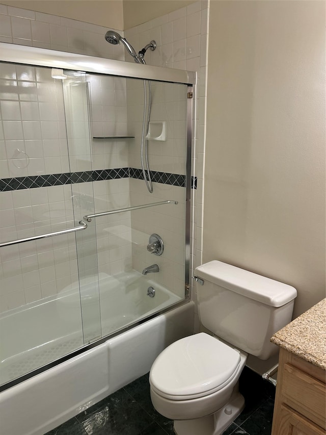 full bathroom with vanity, tile patterned flooring, enclosed tub / shower combo, and toilet