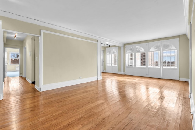 unfurnished room featuring light wood-type flooring