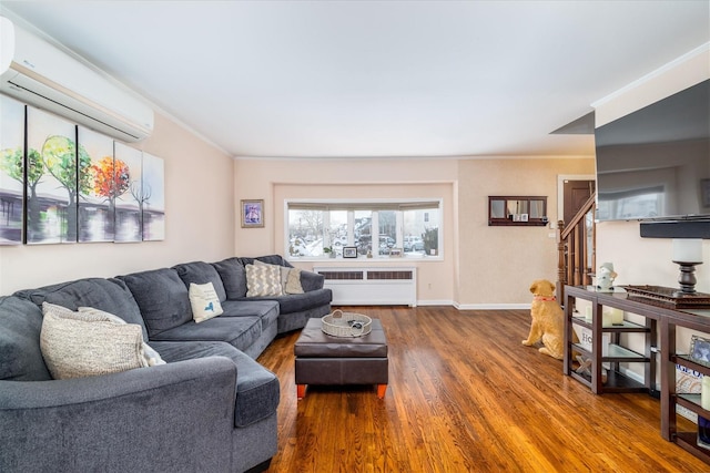 living room with crown molding, radiator, a wall mounted air conditioner, and dark hardwood / wood-style flooring