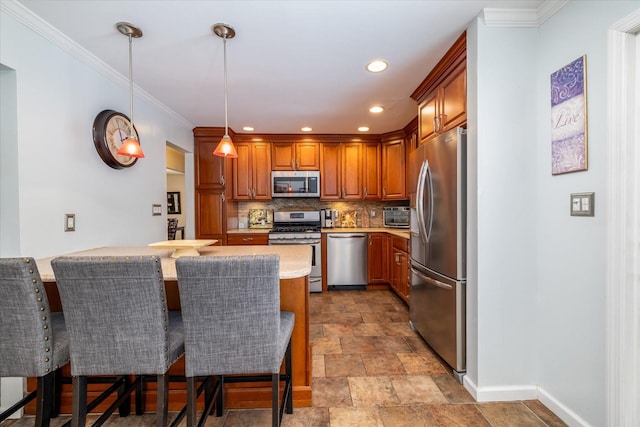 kitchen with a breakfast bar, pendant lighting, tasteful backsplash, kitchen peninsula, and stainless steel appliances