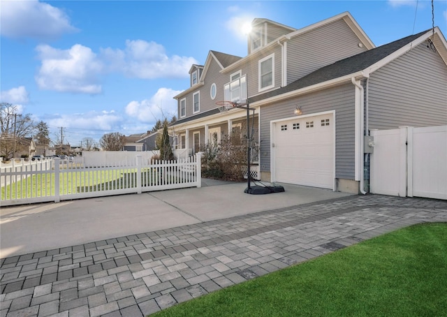 front of property with a garage and a front lawn