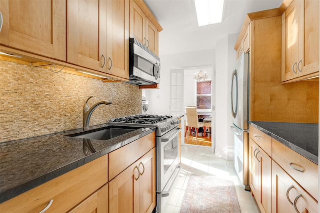 72-10 112th St Unit 3B, Forest Hills, NY 11375 - kitchen with appliances with stainless steel finishes, backsplash, light brown cabinetry, light tile patterned floors, and a sink