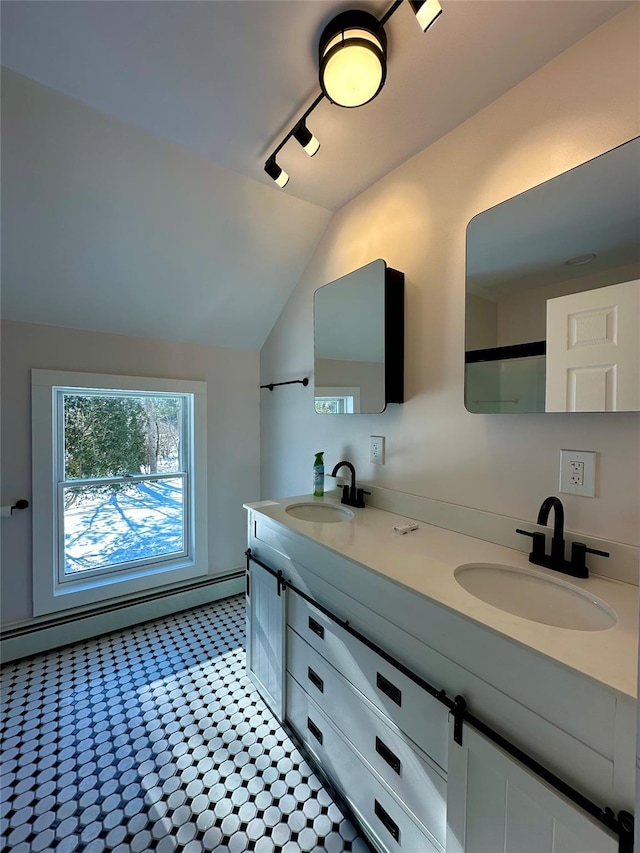 291 Clements Rd, Liberty, NY 12754 - bathroom with a sink, track lighting, double vanity, and a baseboard heating unit