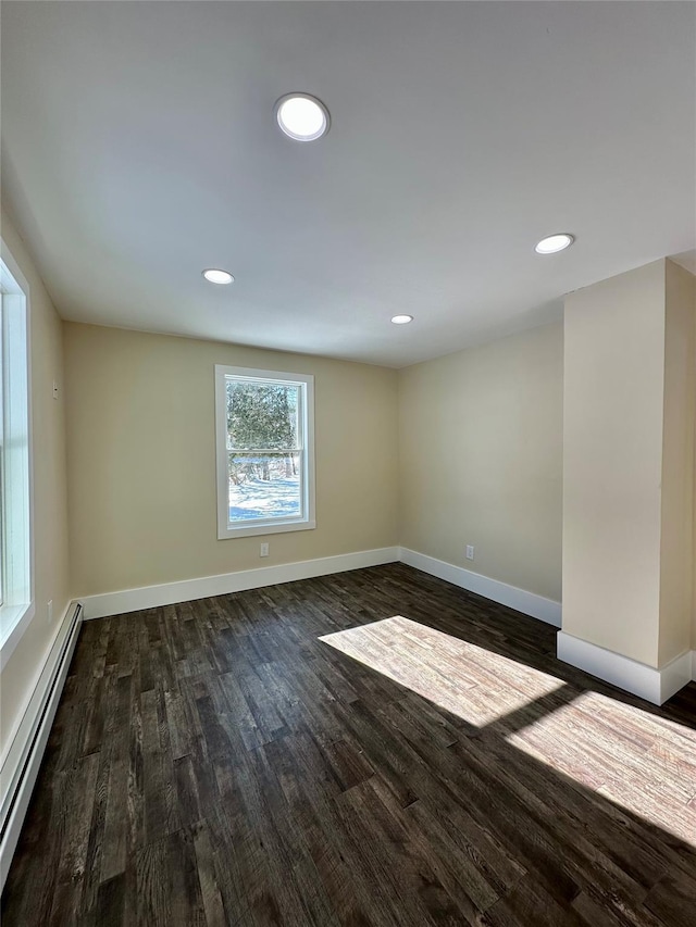 291 Clements Rd, Liberty, NY 12754 - empty room with a baseboard heating unit, baseboards, dark wood-style floors, and recessed lighting