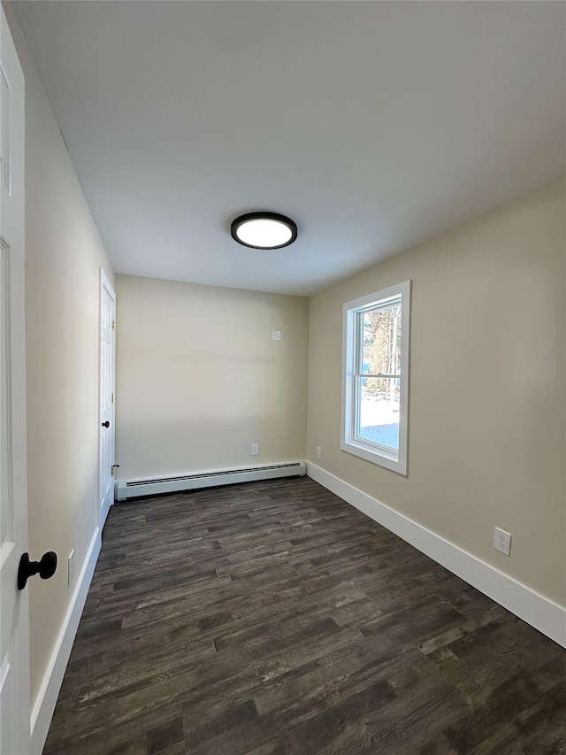 291 Clements Rd, Liberty, NY 12754 - unfurnished room featuring a baseboard radiator, baseboards, and dark wood finished floors