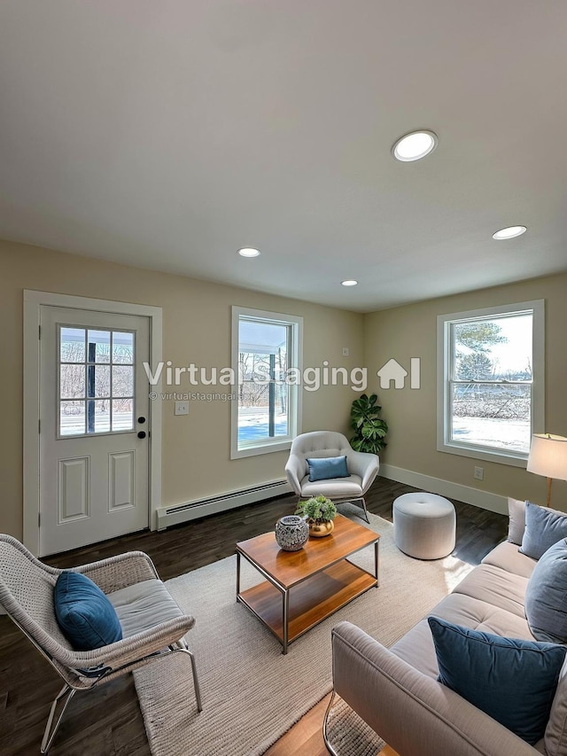 291 Clements Rd, Liberty, NY 12754 - living room with wood finished floors, a baseboard heating unit, baseboards, and recessed lighting