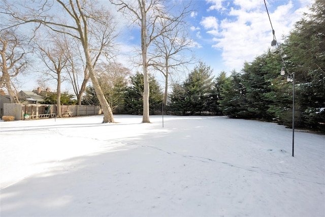 view of yard layered in snow