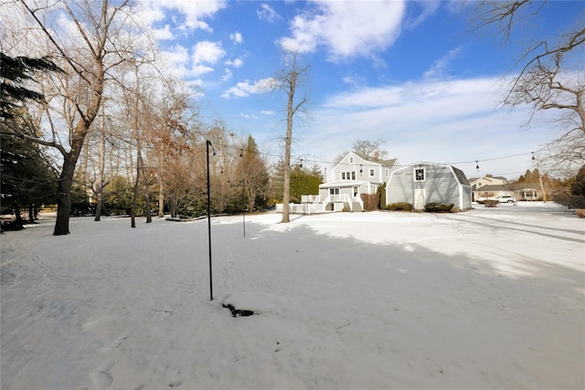 view of yard layered in snow