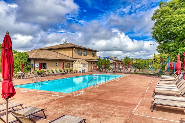 view of swimming pool featuring a patio area