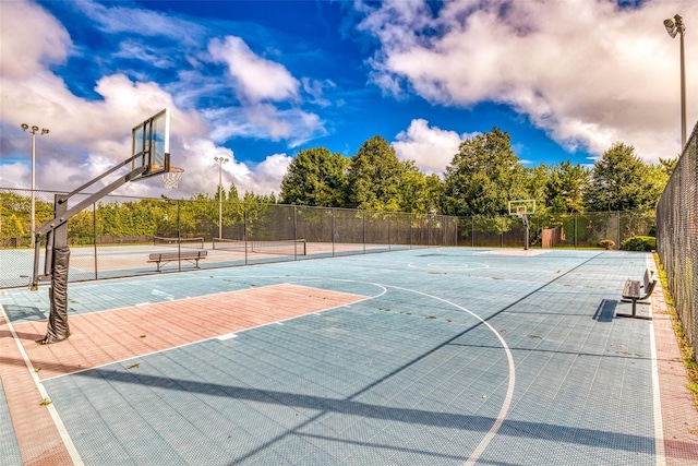 view of basketball court featuring tennis court