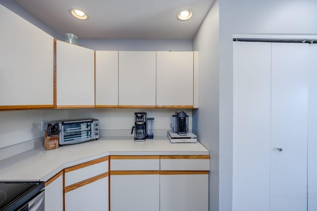 kitchen featuring white cabinetry