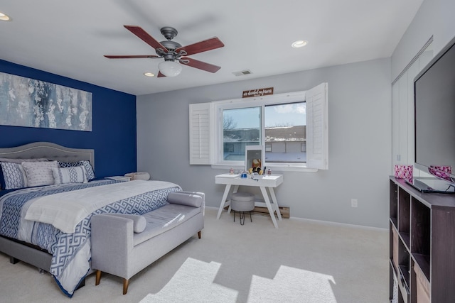 carpeted bedroom with ceiling fan