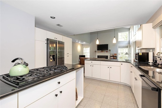 kitchen featuring white cabinetry, appliances with stainless steel finishes, and sink