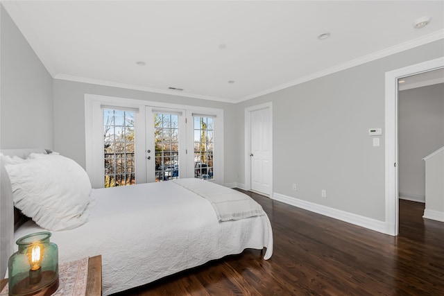 bedroom featuring crown molding, dark hardwood / wood-style flooring, and access to outside