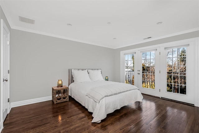 bedroom featuring crown molding, dark hardwood / wood-style floors, and access to outside