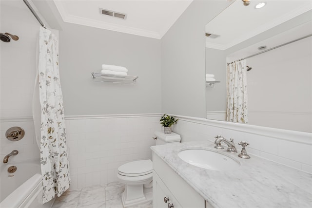 full bathroom with crown molding, toilet, vanity, and shower / bath combo with shower curtain