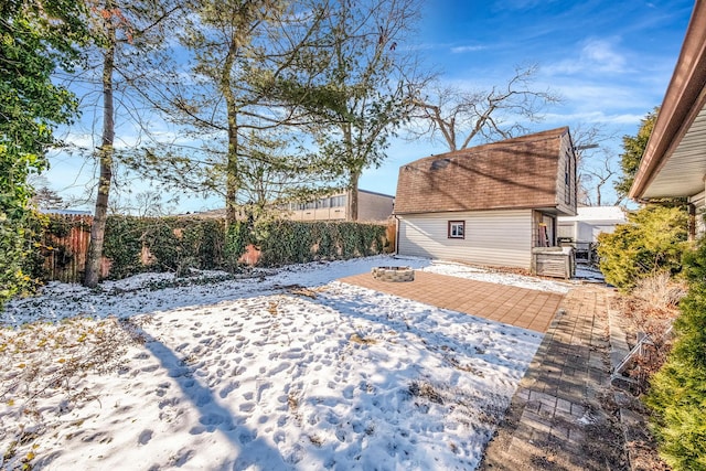 exterior space featuring an outdoor fire pit