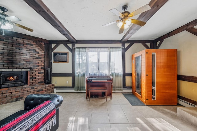 living room with beamed ceiling, a wall mounted air conditioner, a fireplace, and light tile patterned floors