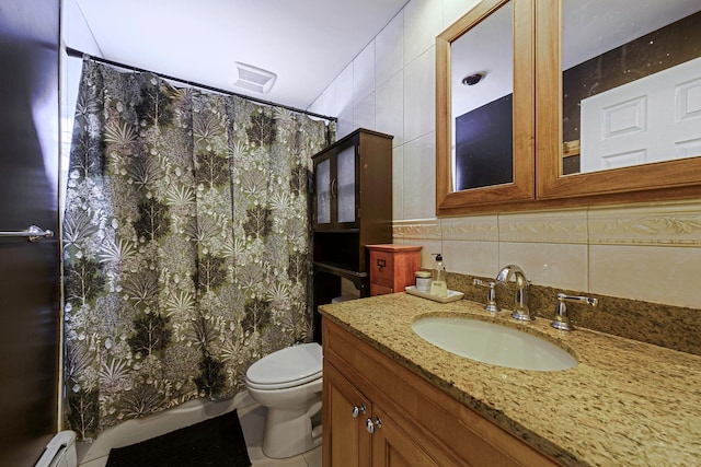 bathroom featuring tile walls, vanity, decorative backsplash, a baseboard radiator, and toilet