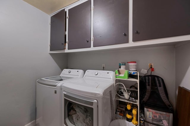 laundry area with cabinets and independent washer and dryer