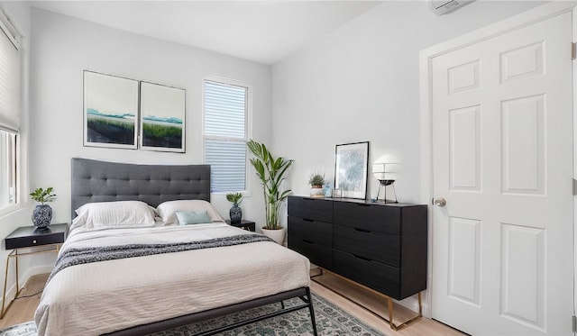 bedroom with light hardwood / wood-style flooring