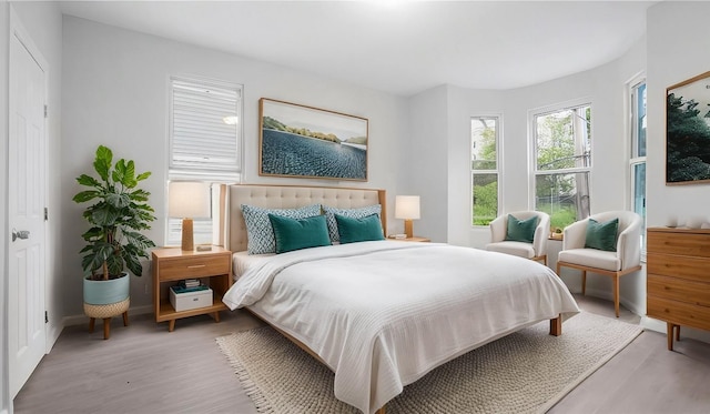 bedroom with light wood-type flooring