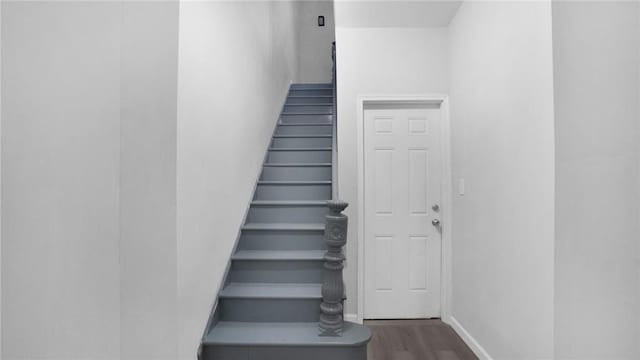 stairs with wood-type flooring