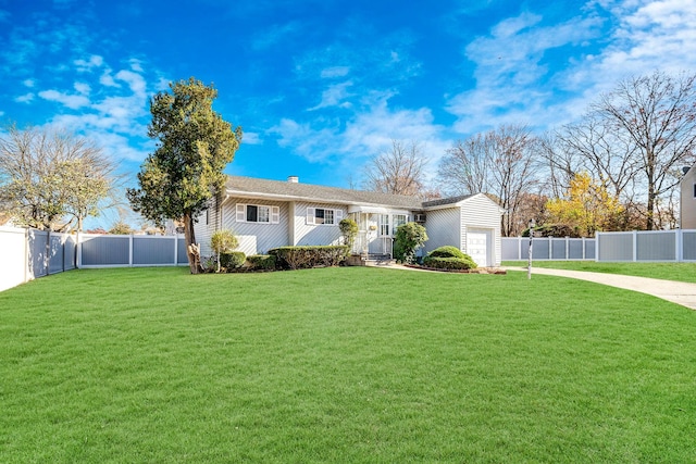 ranch-style house featuring a garage and a front lawn