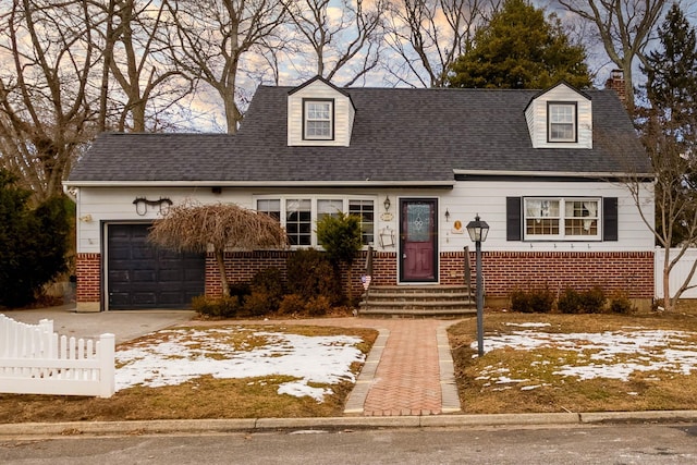 new england style home with a garage