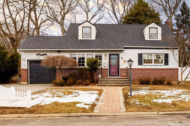 cape cod house with a garage