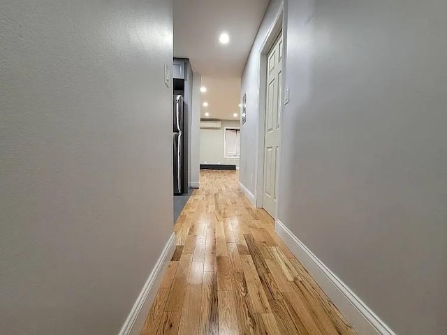 hall with light wood-type flooring