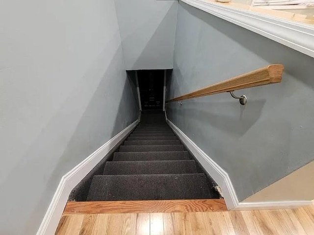 staircase featuring hardwood / wood-style flooring