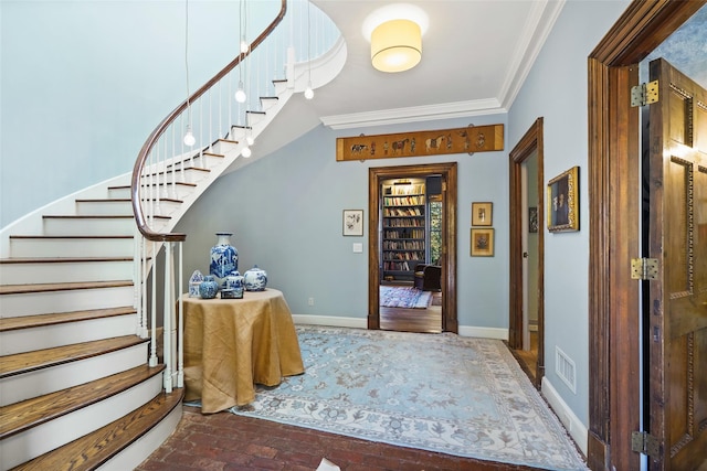 staircase featuring crown molding