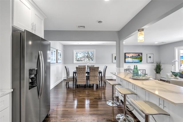 dining area featuring dark wood-type flooring