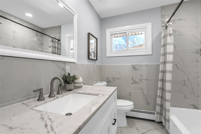 full bathroom with baseboard heating, tile walls, vanity, toilet, and shower / bath combo with shower curtain