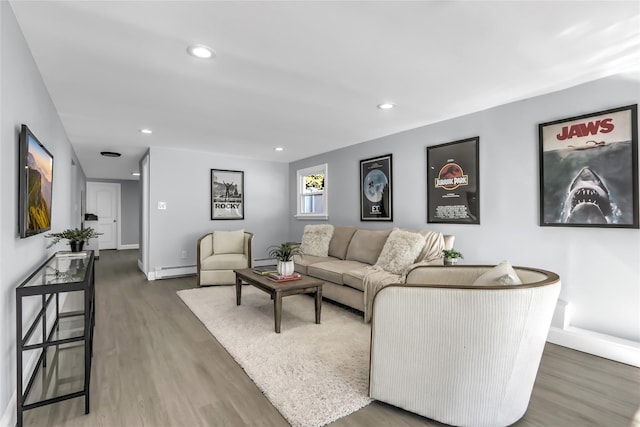 living room with dark wood-type flooring and a baseboard radiator