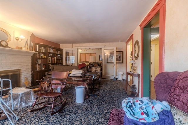 living room featuring a brick fireplace