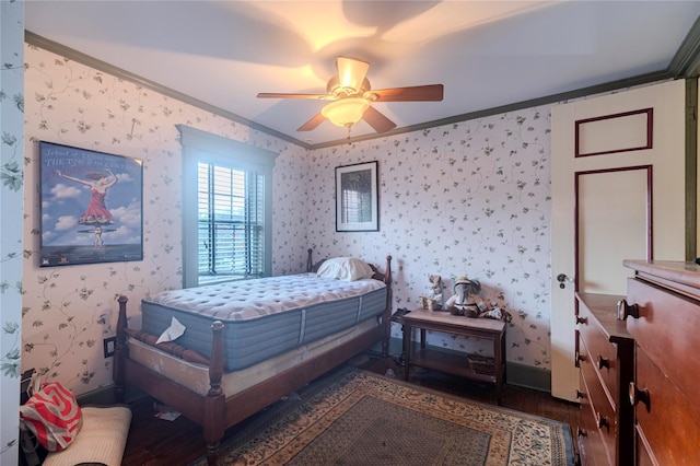 bedroom with crown molding, ceiling fan, and dark hardwood / wood-style flooring