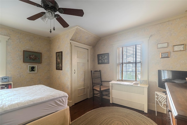 bedroom featuring crown molding, ceiling fan, and dark hardwood / wood-style flooring