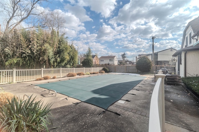 view of swimming pool with a patio