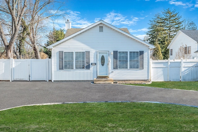 bungalow-style home featuring a front yard