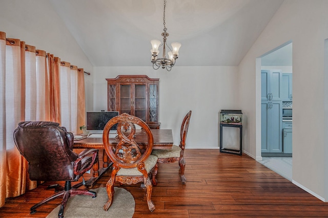 dining space with a notable chandelier, vaulted ceiling, and dark hardwood / wood-style floors