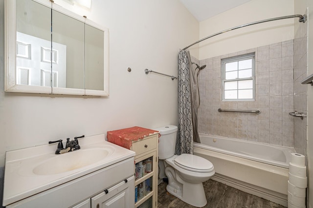 full bathroom with toilet, hardwood / wood-style floors, vanity, and shower / bath combo with shower curtain