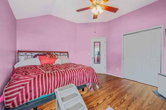 bedroom with wood-type flooring, lofted ceiling, and ceiling fan